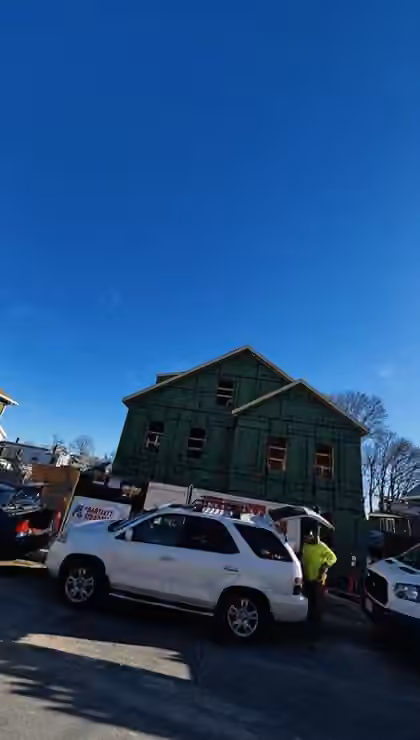 New construction home wrapped and weatherproofed, street view