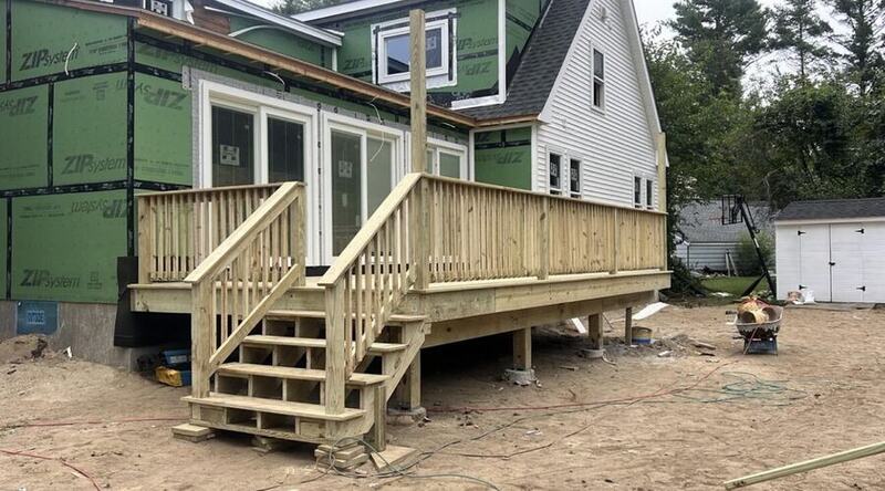 Completed wood deck with custom stairs