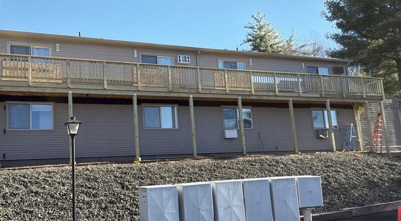 Completed elevated deck with new railings