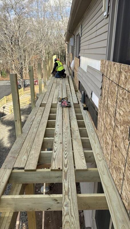 Deck joist framing beside a building