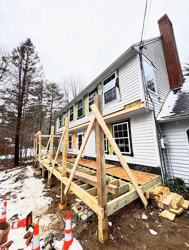Rear home addition framing on a house
