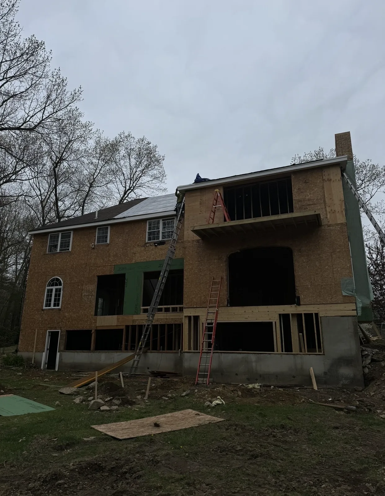 Two-story home addition during exterior construction