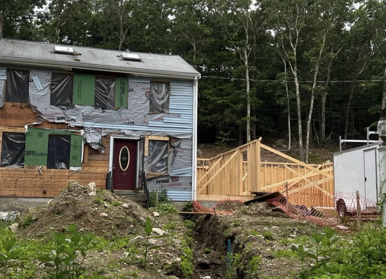 Wood framing for a custom rear home addition by FJ Global